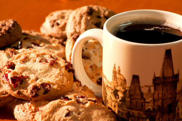 Chocolate and strawberry cookies with a cup of coffee