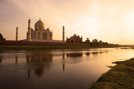 Sunset at the Taj Mahal reflected in the Yamuna River.