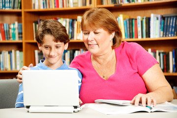 Fototapeta na wymiar Mother Helps Son Study