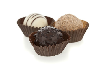 Gourmet chocolate bonbons isolated on white background.