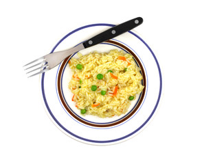 Rice pilaf in dish on white background