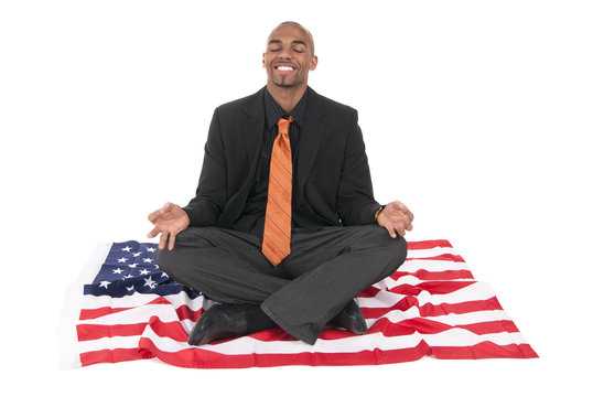 businessman on a US flag - Powered by Adobe