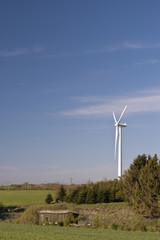 Fototapeta na wymiar Windmill Against the Blue Sky