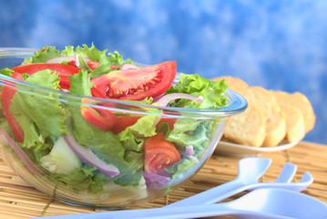 Salad with baguette slices in the back