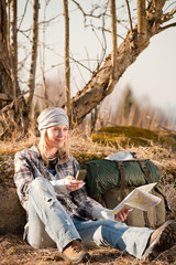 Camping young woman search navigation compass map in countryside
