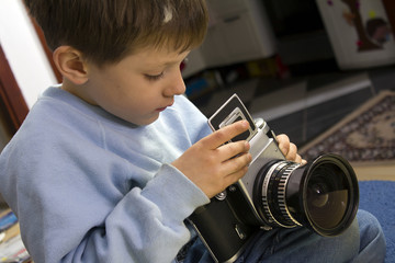 Young boy with camera