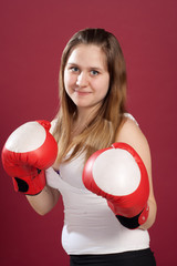 Portrait of girl in boxing gloves