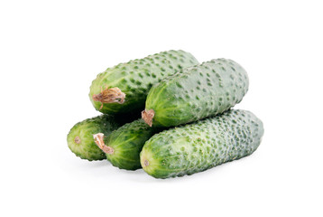 Several fresh cucumbers on a white background
