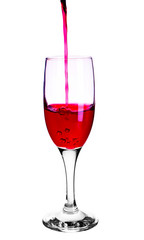 Red wine pouring into wine glass