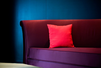 red pillow on a sofa