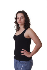 Fototapeta premium Young Brunette in Black Tank Top with Hands on Hips to Side