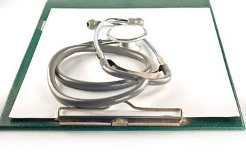 Stethoscope and clipboard isolated on white background