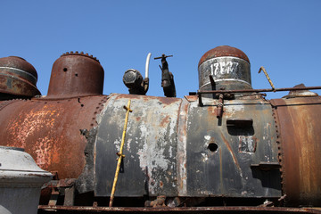 Fototapeta na wymiar Junk - old rusty train locomotive