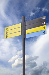 Colorful plastic informational signs with arrows.