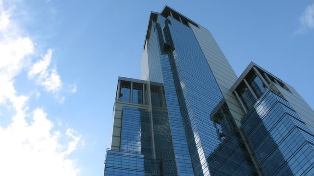 Clouds reflect in newly build skyscraper in Moscow, time lapse