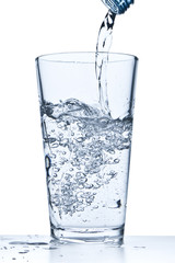 pouring water into glass