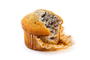 Blueberry muffin with a missing bite over white