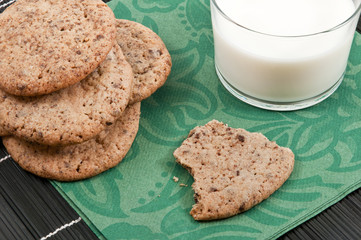 Close-up of cookies on a plate with a glass of milk