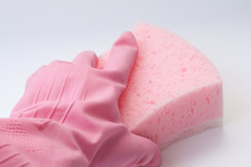 Hand in  rubber glove holding a sponge