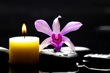 Schilderijen op glas spa scene -aromatherapy candle and pink orchid on zen stones © Mee Ting