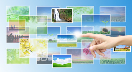 Male hand selecting images multimedia information flow .