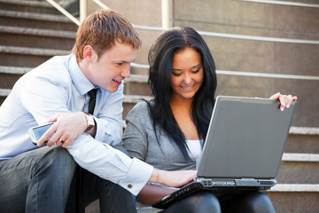 Young couple working on laptop