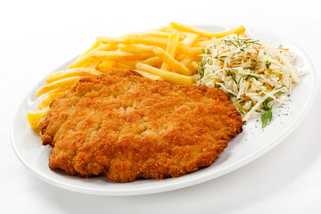 Pork chop, French fries and vegetables