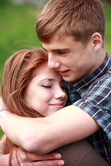 Fototapeta premium Portrait happy young teenage couple outdoor