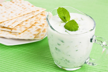 Fresh Greek Tzatziki dip with cucumber and matzo bread