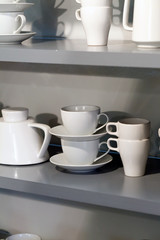 white cups on the shelf