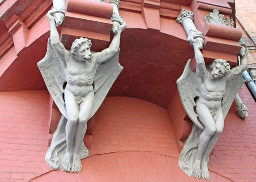 Architecture demon with wings on wall of house in Kiev, Ukraine