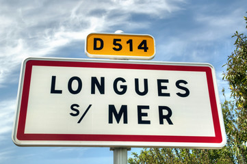 Longues-Sur-Mer - Panneau de commune