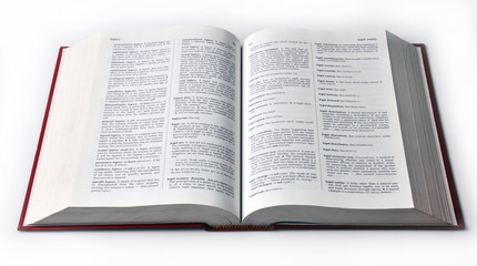 Open dictionary book isolated on white background.