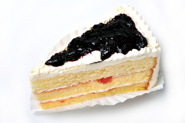 piece of blueberry cake on paper cup isolate on white background