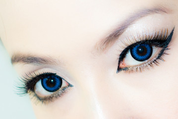 Naklejka premium woman blue color eyes closeup