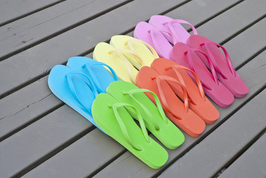 Colorful Flip Flops on a Deck