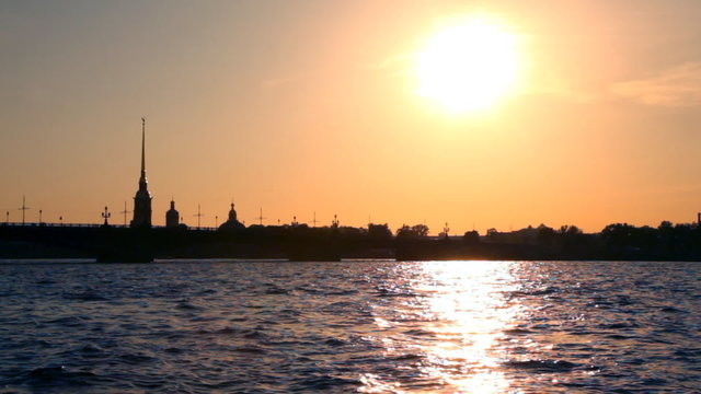 boat floats on river channel to St. Petersburg in evening