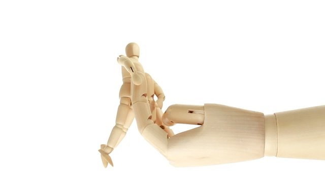 rotation of wooden toy giant arm with little toy man outside
