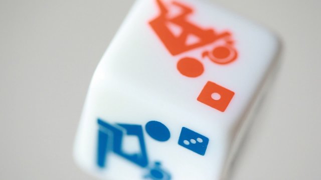 white rolling dice with camasutra positions and dots