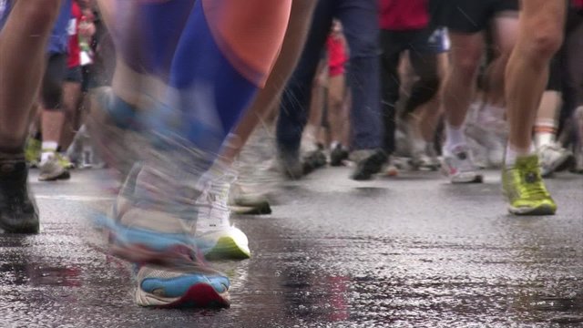 Close-up of legs of runners
