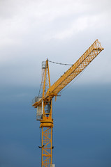 Building crane on menacing sky