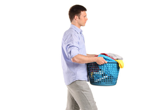 Young Man Carrying A Laundry Basket