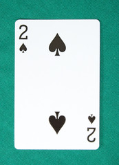 two of spades on card table