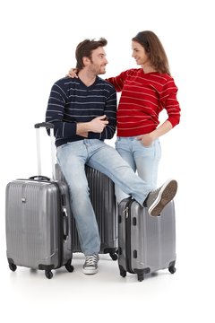 Happy young couple travel with baggages