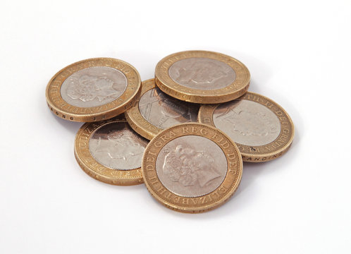 British, UK, two pound coins on a plain white background.