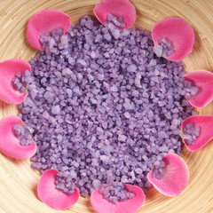 A beautiful spa composition of pink petals and purple salt