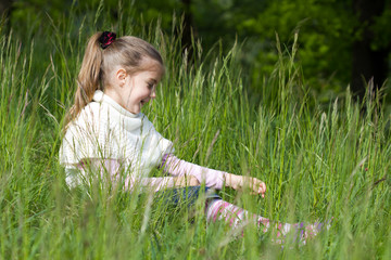 little girl on grass