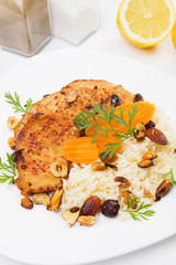 Asian style pork chops with rice and roasted nuts