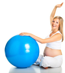 Pregnant woman excercises with gymnastic ball