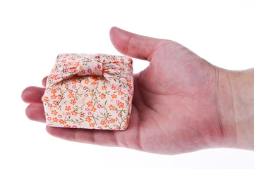 Nice gift box on hand isolated on white background